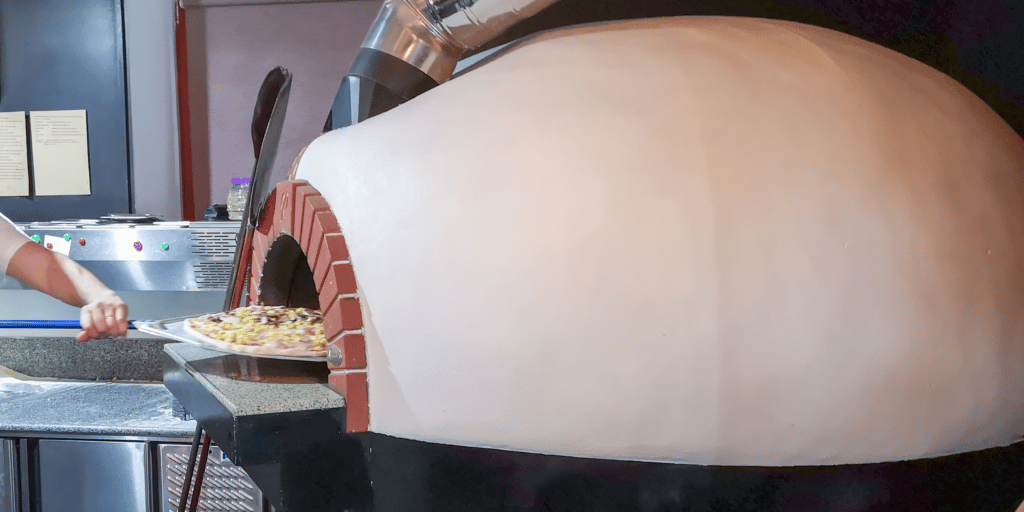 igloo pizza oven with white stucco