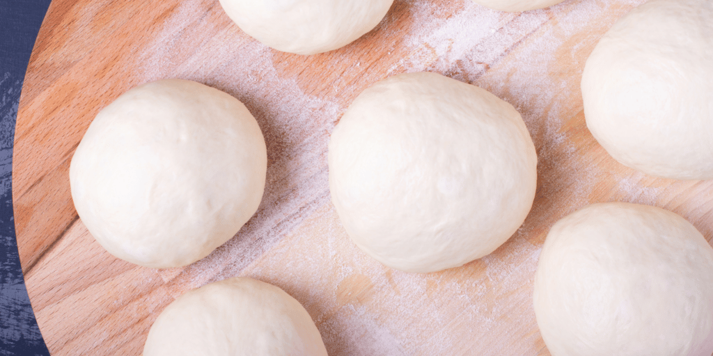 shaping dough balls or doughnating