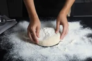 pizza dough on floured surfaced