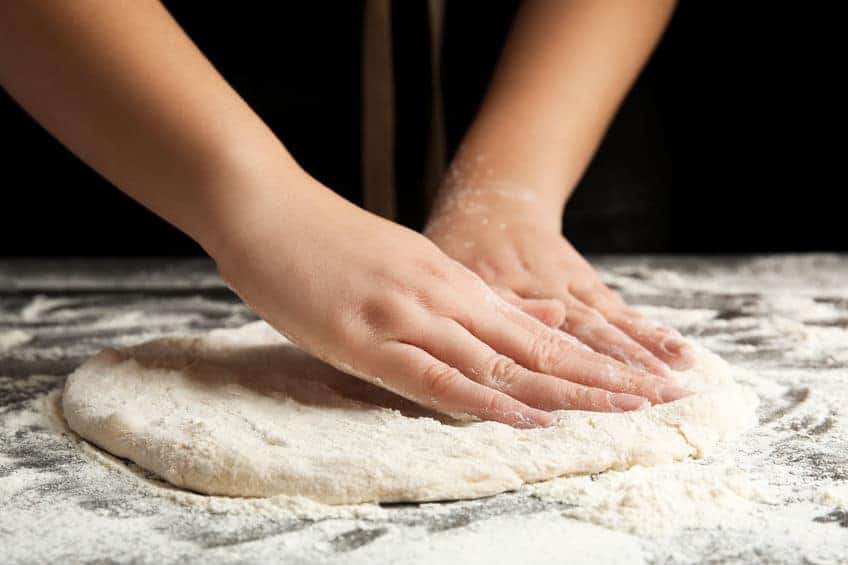 stretching pizza dough