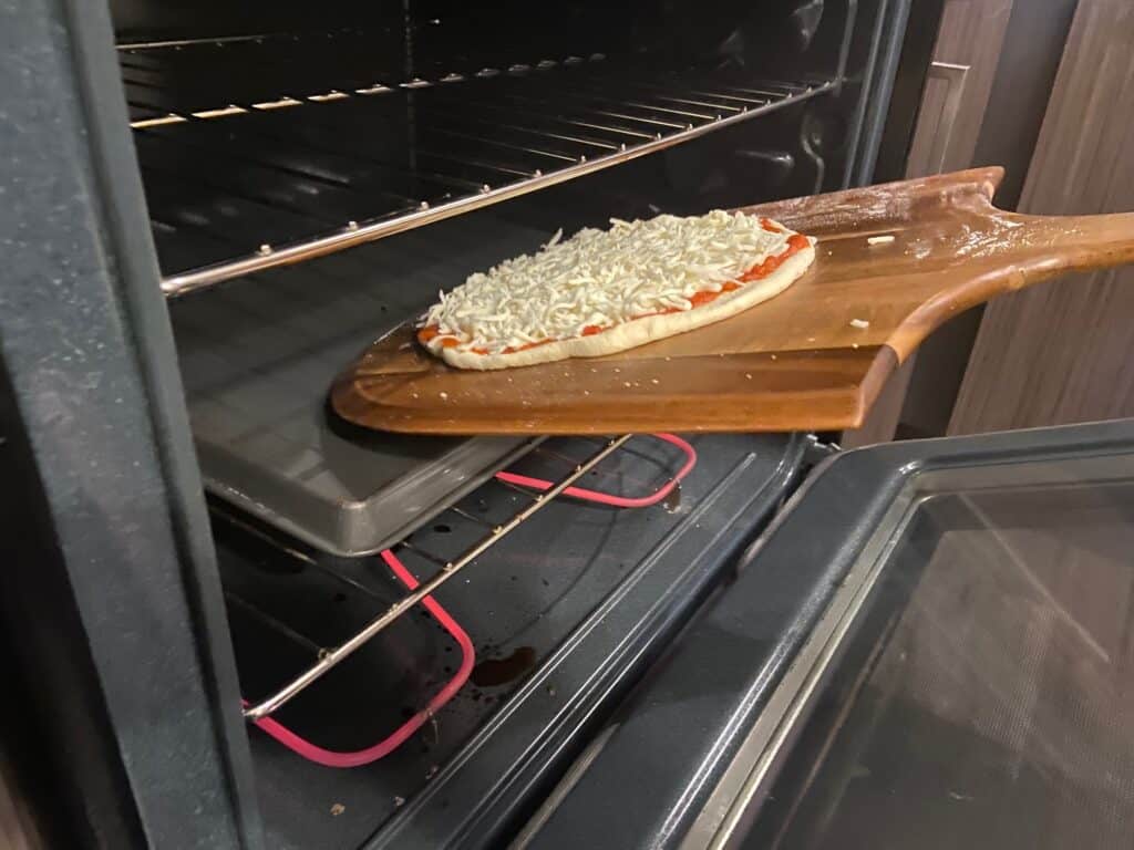 Slide pizza into oven