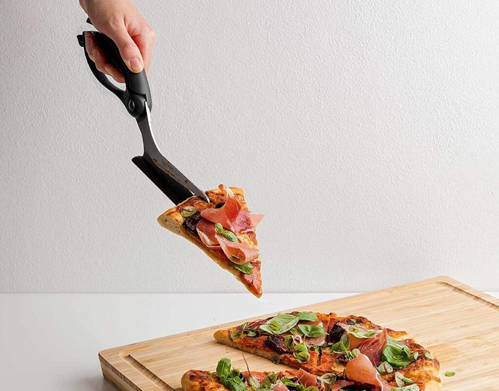 cutting pizza with scissors