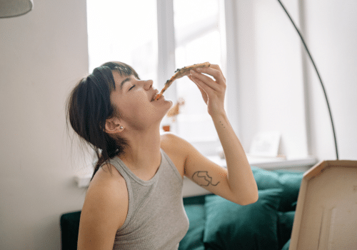 Person enjoying pizza